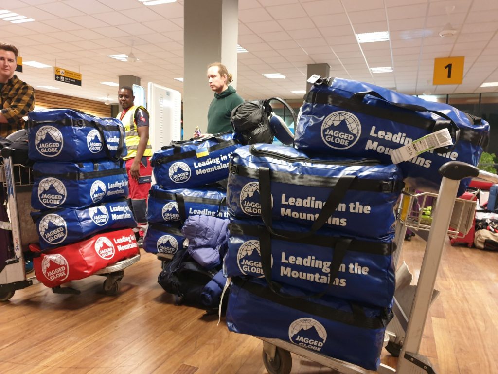 Kit bags piled on luggage trollies