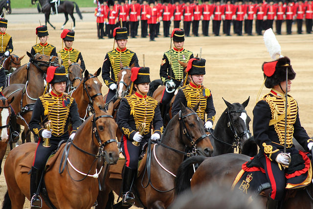 Solidiers on horseback, in a balck jacket with gold frogging