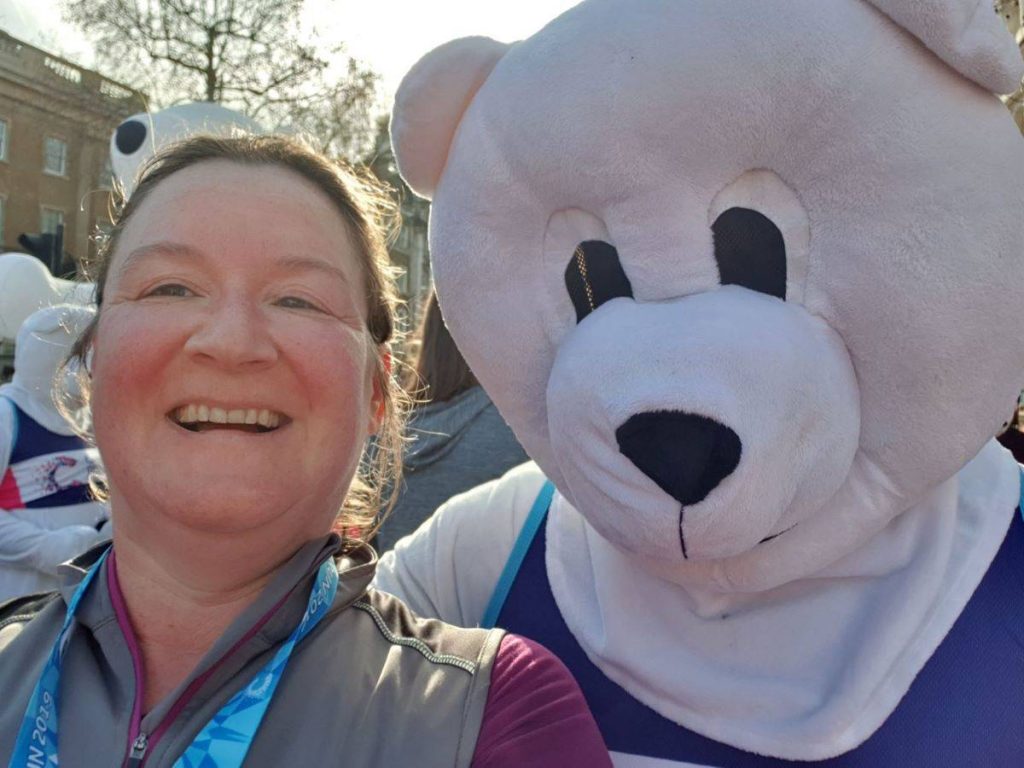 Me next to a Polar bear - a person in a polar bear outfit, after the Winter Run