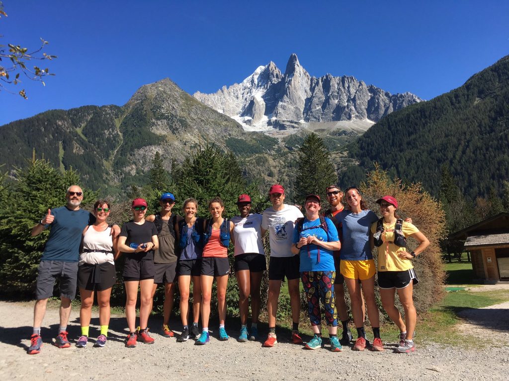 A group of runners posed, in the mountains