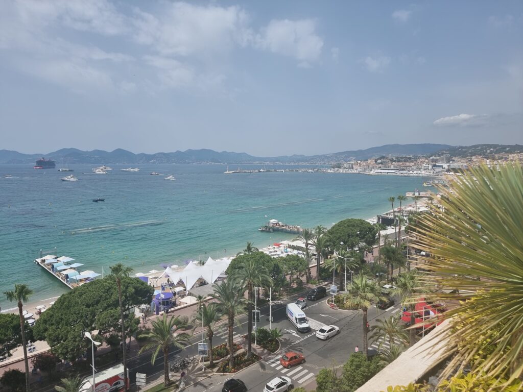 taken from hotel upper floor, a view of the Cannes beach and bay