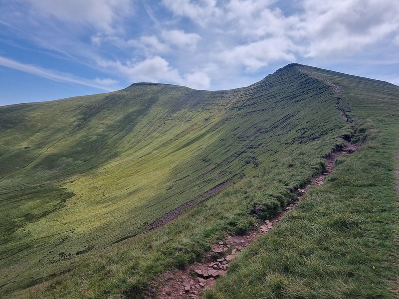 A view looking up at Pen Y Fan and Corn Du mountains. Blue skies so you can actually see them. 