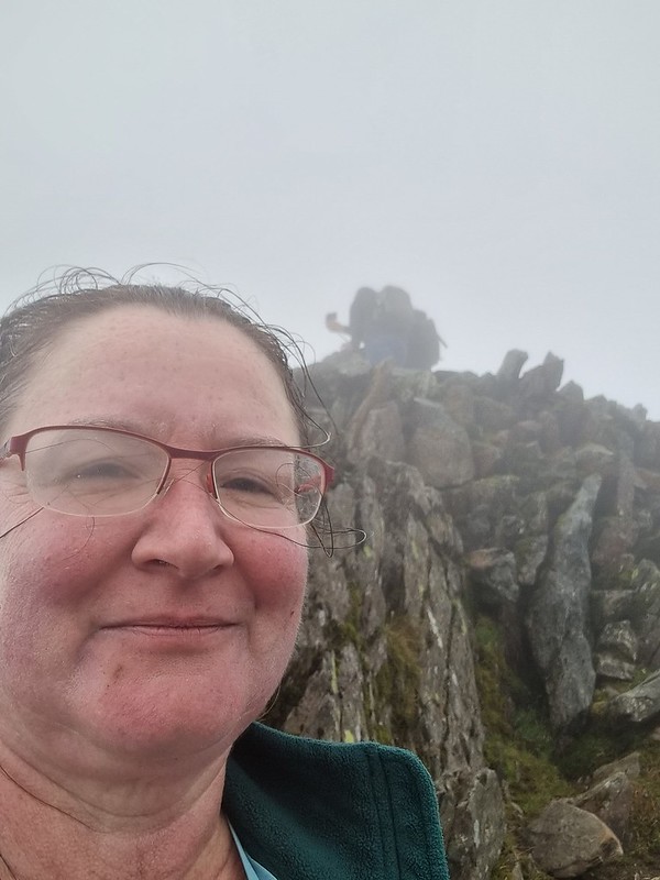 Selfie with the Snowdon Peak marker behind me in the mist