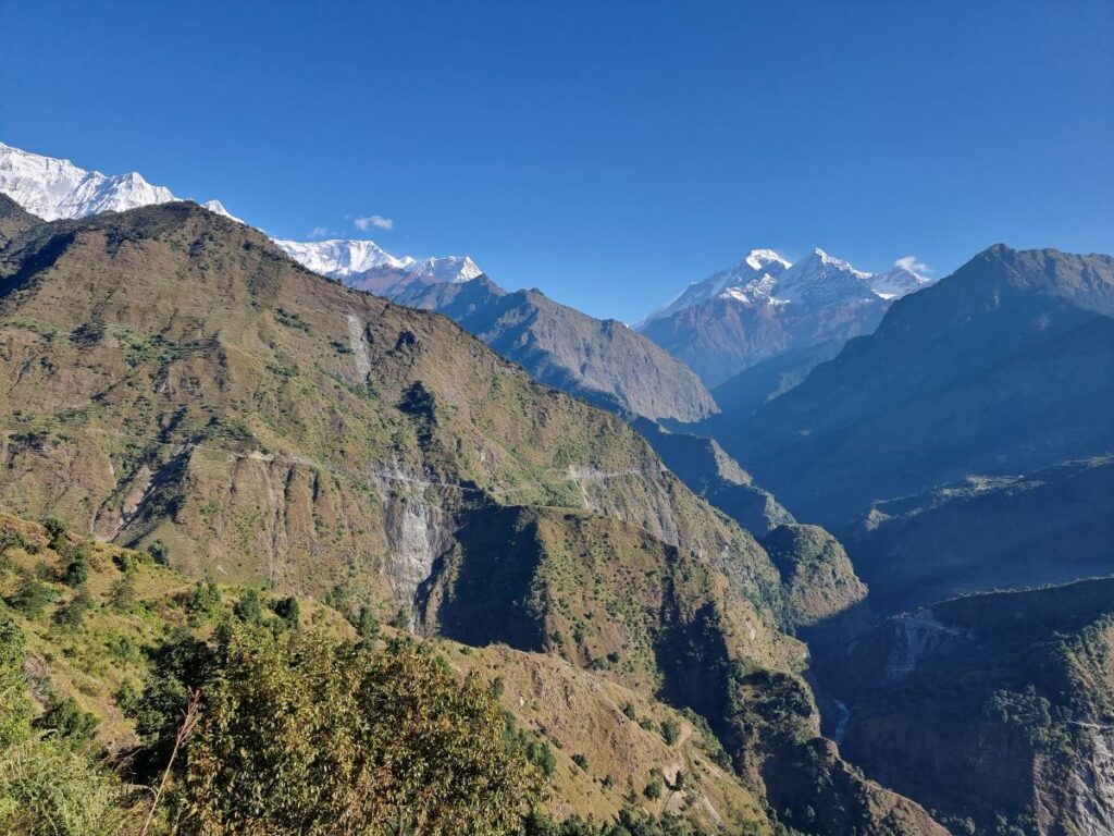 mountains and valleys, still with vegetation. You can see the path across the valley