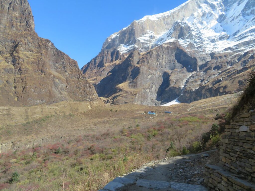 View to small collection of buildings that is Italian Base Camp. Behind are the lower slopes of Dhaulagiri 1