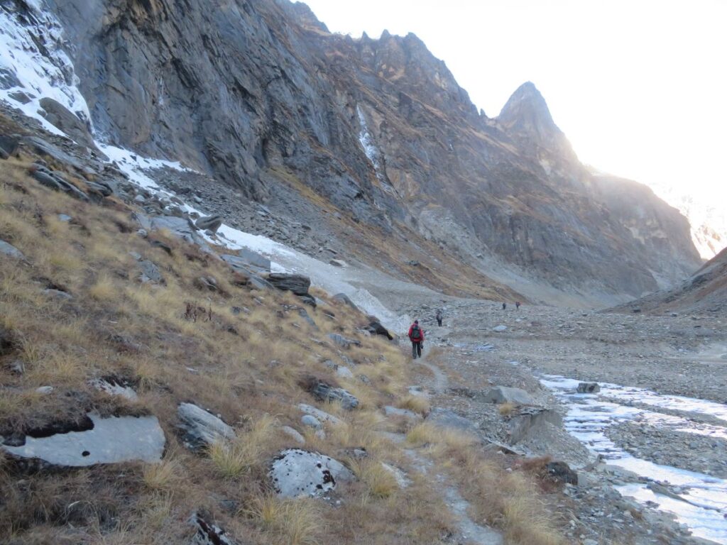 Rocky valley with some grass. Sides have a lot of rockfall